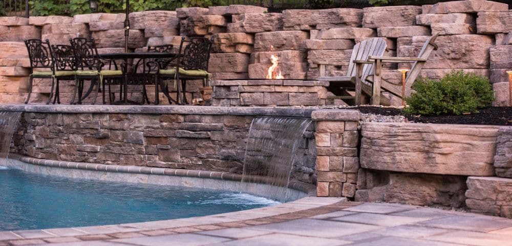 pool hardscape with firepit