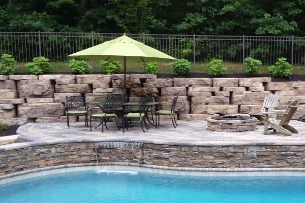 poolside patio area with table and chairs