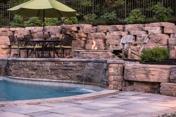 pool hardscape with firepit