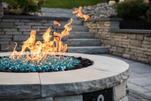 A raised stone firepit. 