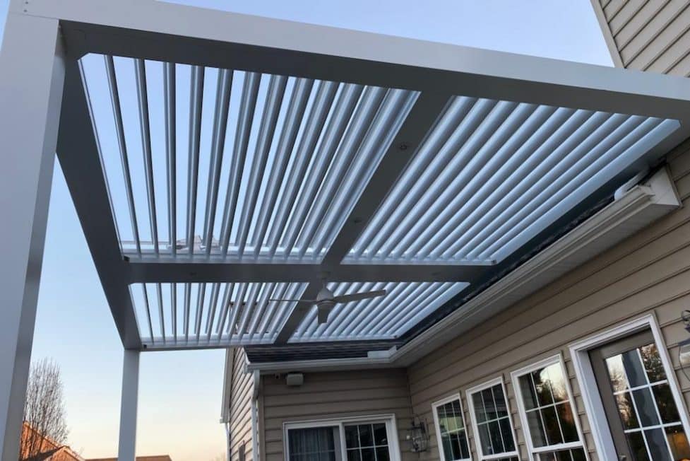 A vinyl pergola attached to a house.