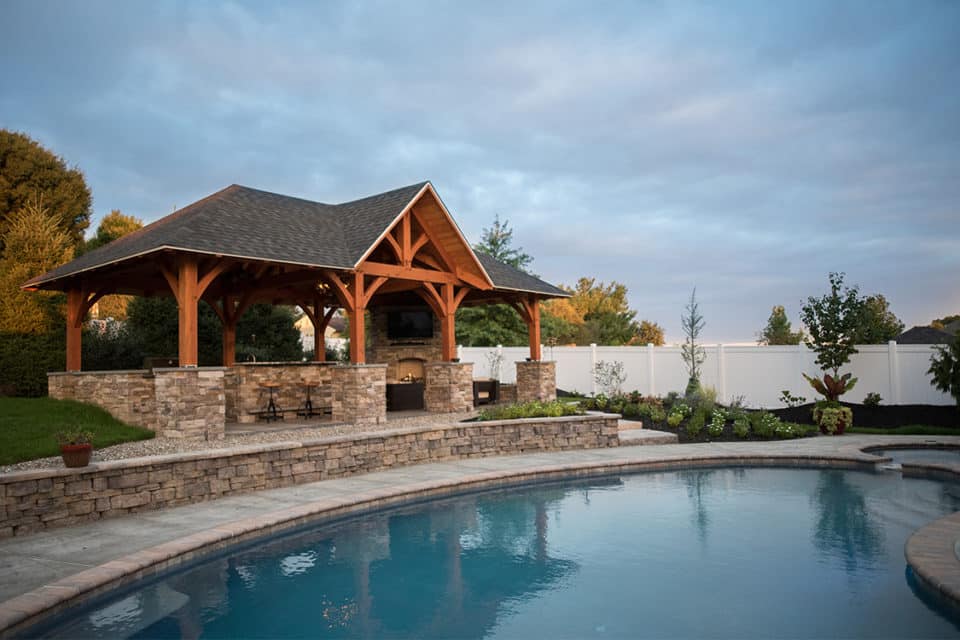 Stone patio by a pool.