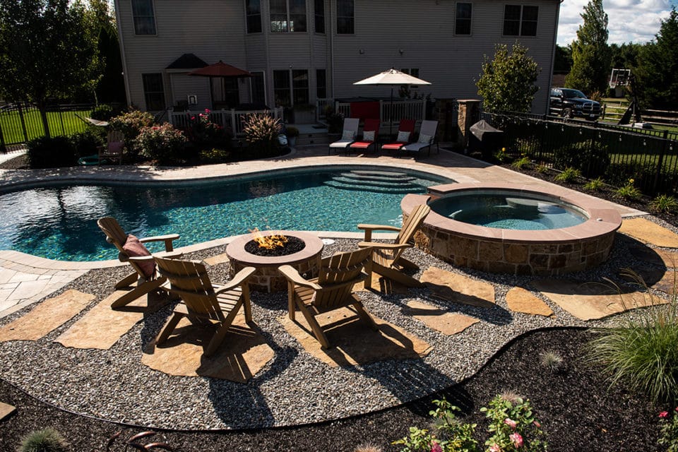 A fire feature near a pool.