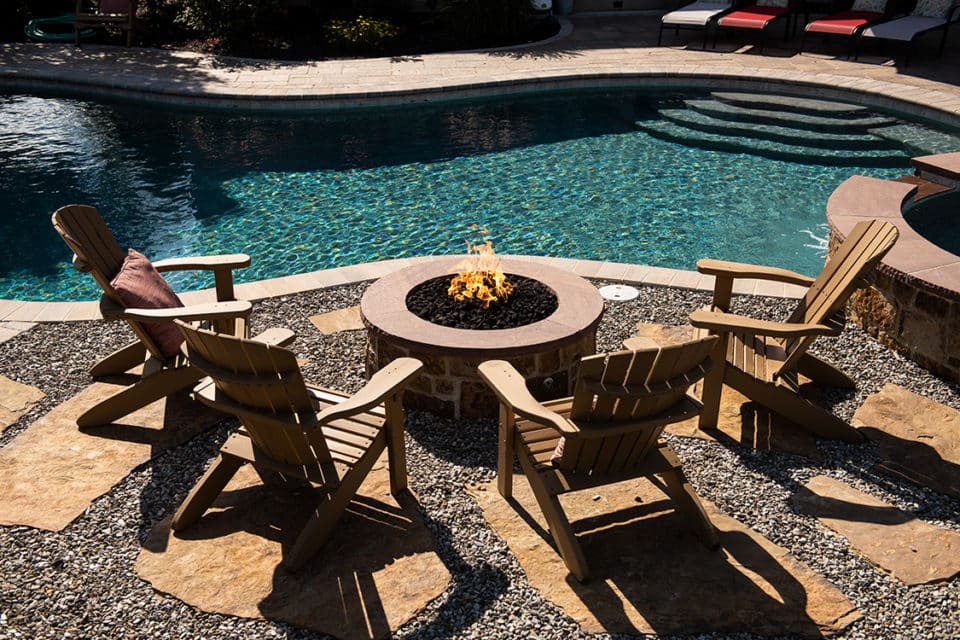 A fire feature near a pool.