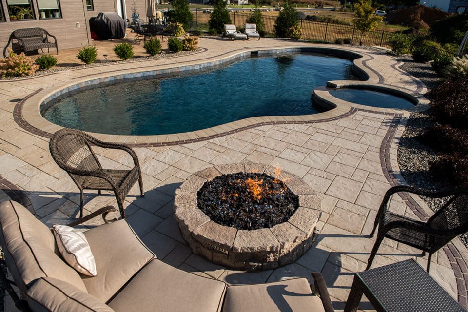 A fire feature near a pool.