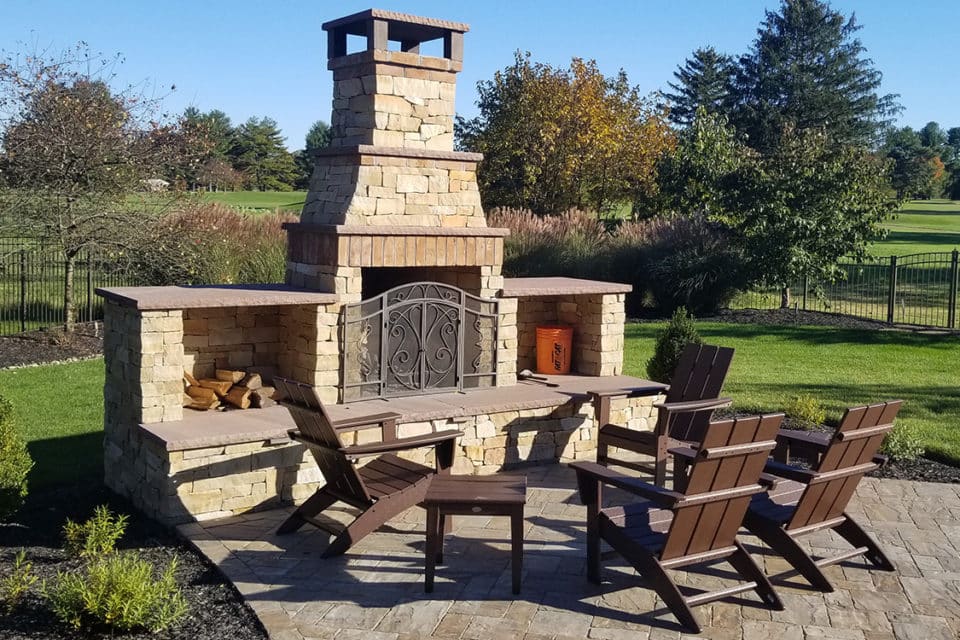 A stone fireplace and chimney.